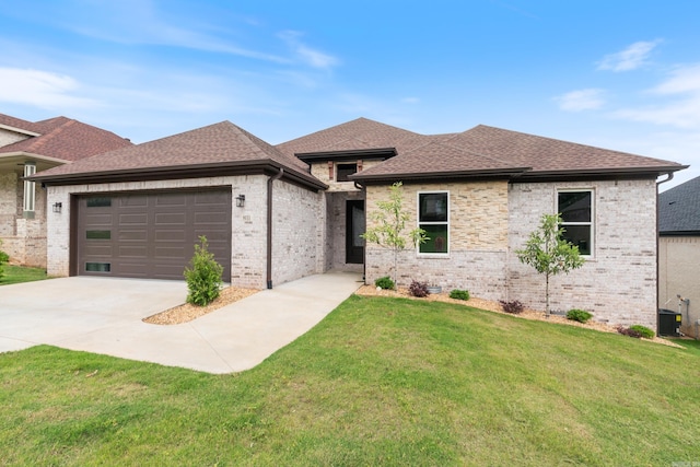 prairie-style house with a front lawn and a garage