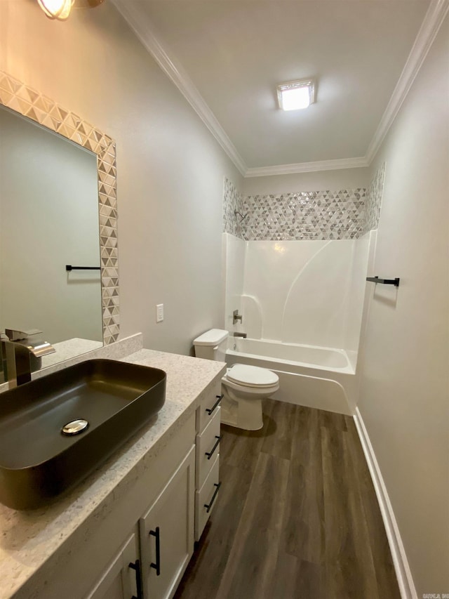 full bathroom featuring vanity, toilet, ornamental molding, and hardwood / wood-style floors