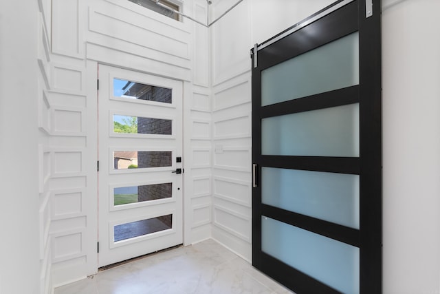 foyer entrance with a barn door