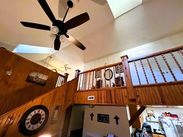 details with wood walls and a skylight