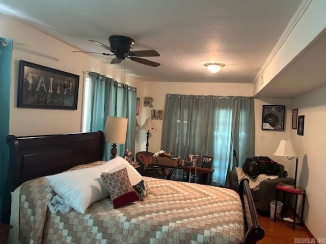 bedroom with hardwood / wood-style flooring and ceiling fan