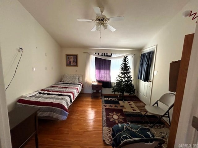 bedroom featuring dark hardwood / wood-style flooring and ceiling fan