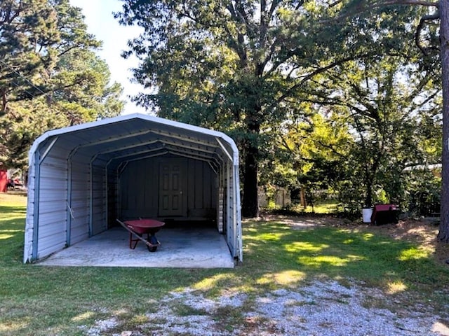 view of outdoor structure featuring a yard and a carport