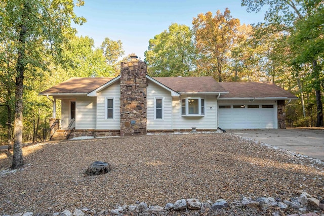 ranch-style home featuring a garage