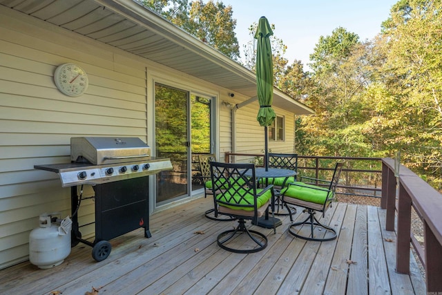 wooden deck featuring grilling area