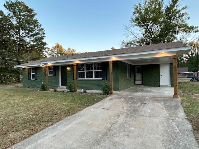 ranch-style house with a front yard and a carport