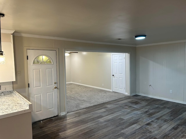 entrance foyer with ceiling fan, ornamental molding, and dark hardwood / wood-style floors