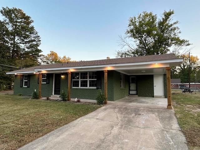 single story home with a front lawn and a carport