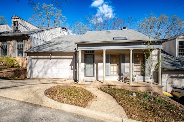 view of front of home featuring covered porch and a garage