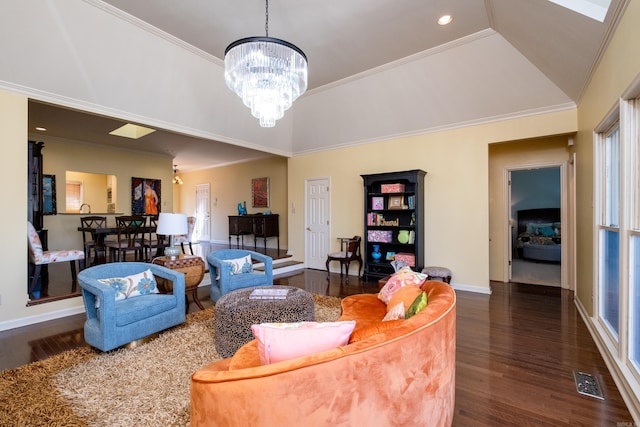 living room with lofted ceiling, ornamental molding, dark hardwood / wood-style flooring, and a chandelier