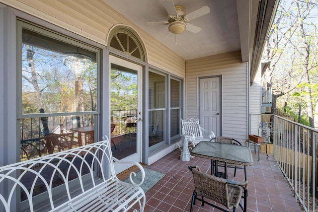 balcony featuring a patio area and ceiling fan