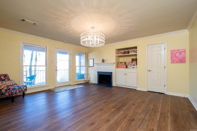 unfurnished living room featuring crown molding, a chandelier, and dark hardwood / wood-style flooring