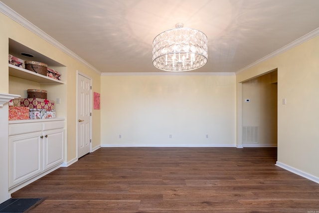 unfurnished dining area with ornamental molding, dark hardwood / wood-style floors, and an inviting chandelier