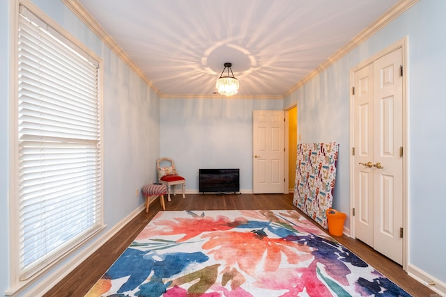 bedroom featuring a chandelier, crown molding, multiple windows, and dark hardwood / wood-style floors