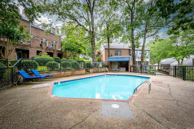 view of swimming pool featuring a patio