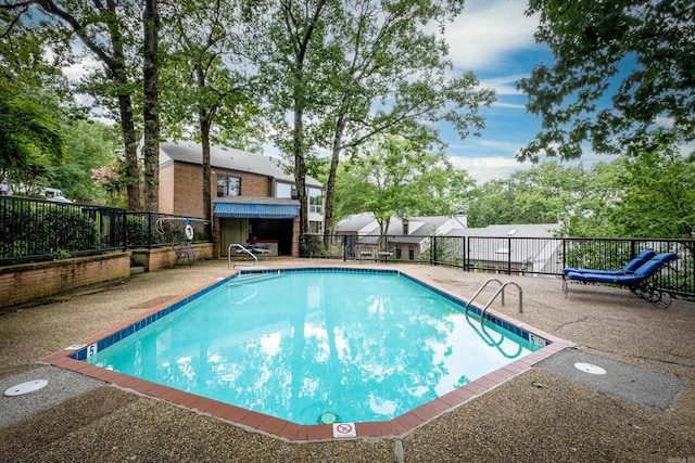 view of swimming pool featuring a patio