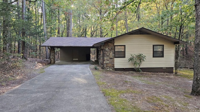 ranch-style house with a carport