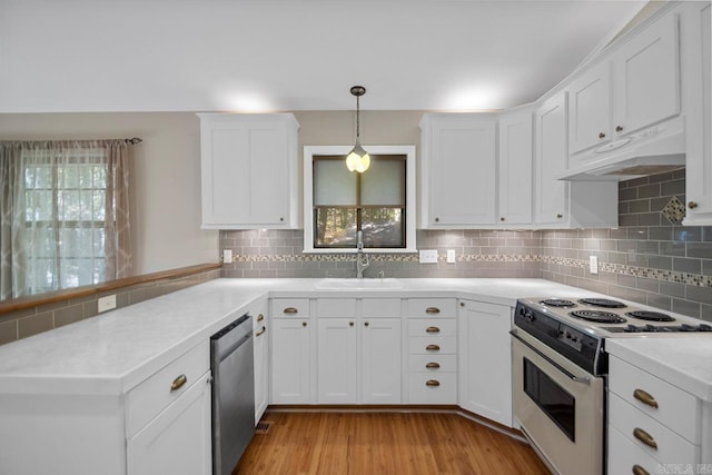 kitchen with a healthy amount of sunlight, decorative backsplash, sink, and white range with electric stovetop