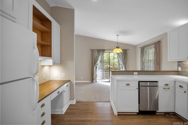 kitchen featuring lofted ceiling, dark wood-type flooring, white cabinets, and white refrigerator