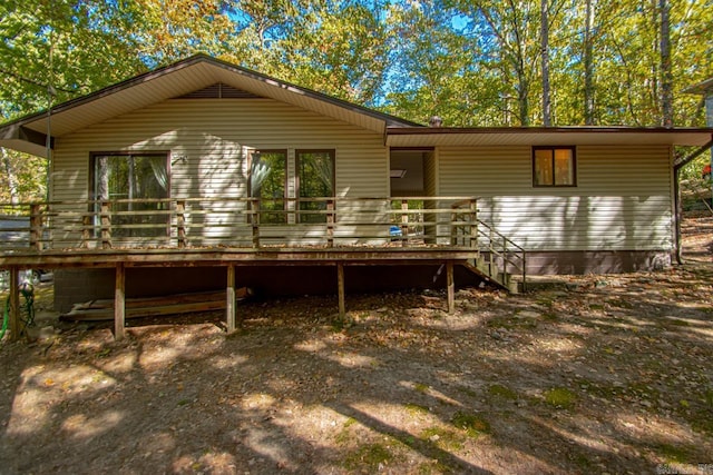 back of property featuring a wooden deck