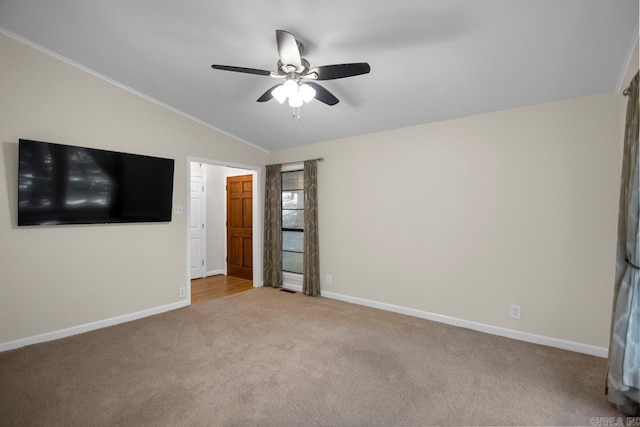 unfurnished bedroom featuring light carpet, vaulted ceiling, and ceiling fan