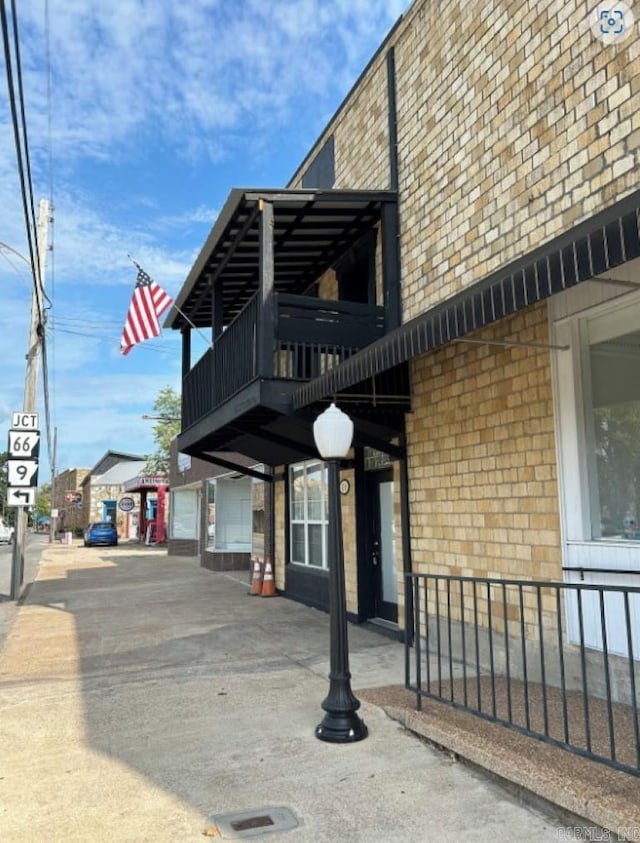 view of home's exterior featuring a balcony