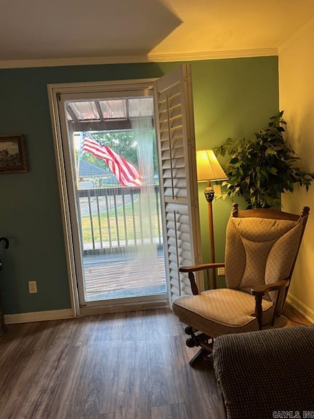 doorway with dark hardwood / wood-style floors and ornamental molding