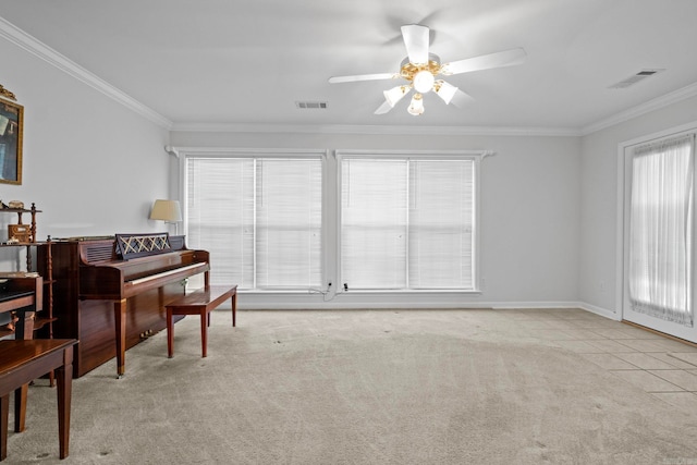 interior space featuring light carpet, crown molding, plenty of natural light, and ceiling fan