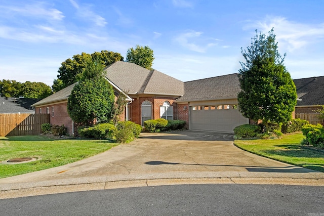 view of front facade with a garage and a front lawn