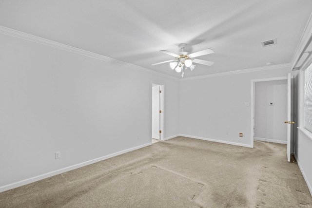 carpeted empty room featuring ornamental molding and ceiling fan