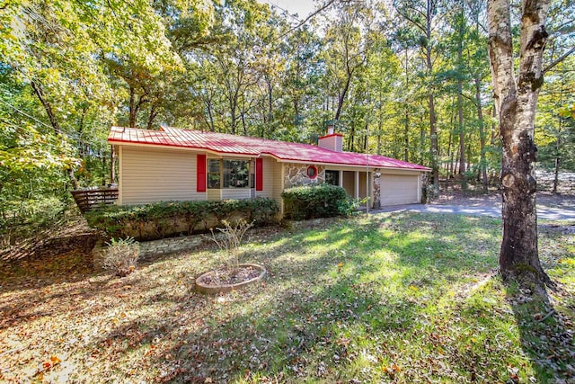 ranch-style home with a front yard and a garage