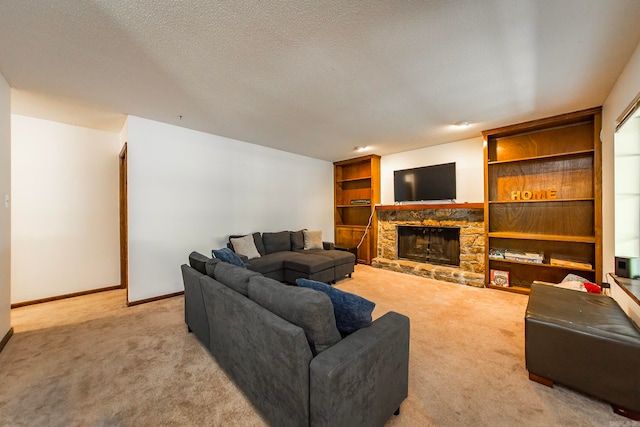 carpeted living room featuring a textured ceiling and a fireplace