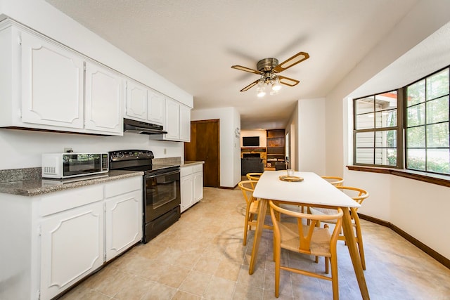 kitchen with black / electric stove, light tile patterned flooring, white cabinetry, and ceiling fan