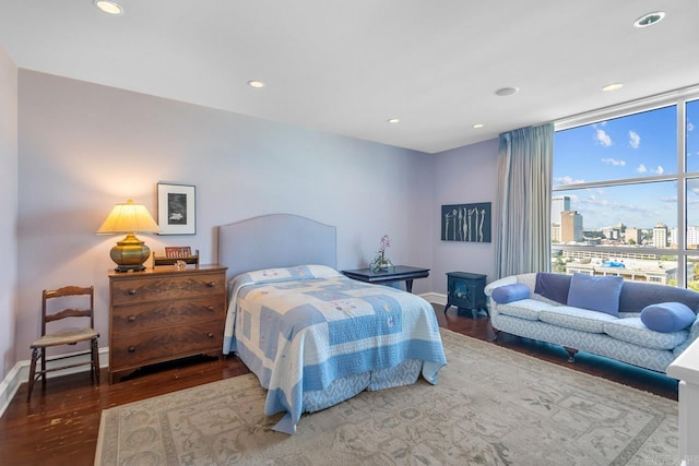 bedroom with hardwood / wood-style flooring