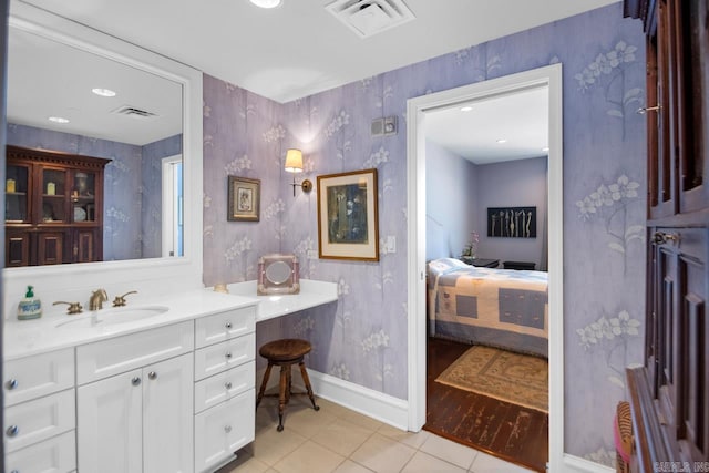 bathroom with vanity and tile patterned floors