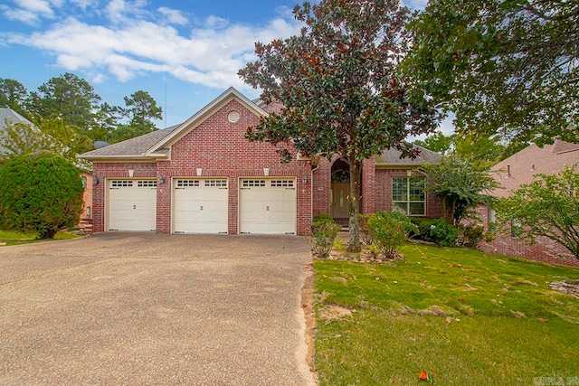 view of front facade featuring a front yard and a garage