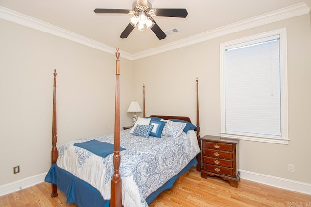 bedroom with light hardwood / wood-style floors, ornamental molding, and ceiling fan