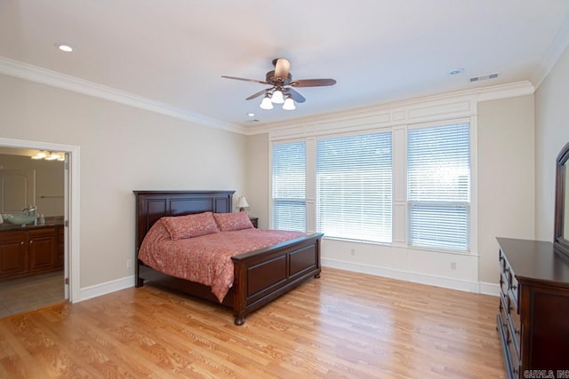 bedroom featuring ornamental molding, ensuite bath, light wood-type flooring, and ceiling fan