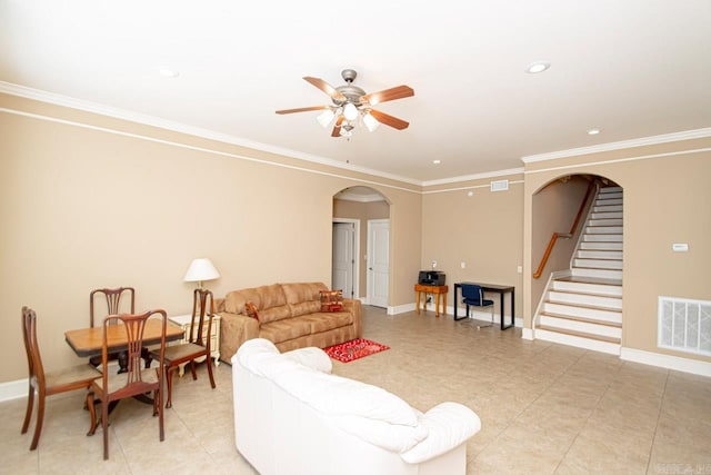 living room with crown molding and ceiling fan