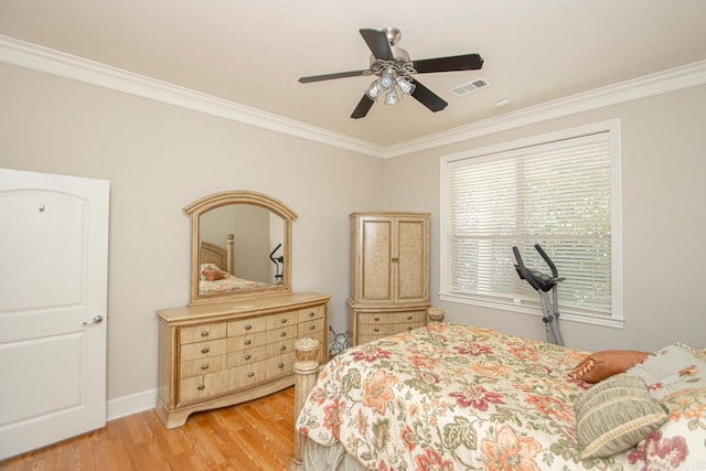 bedroom with ceiling fan, crown molding, and light hardwood / wood-style floors