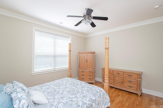 bedroom with crown molding, light wood-type flooring, and ceiling fan