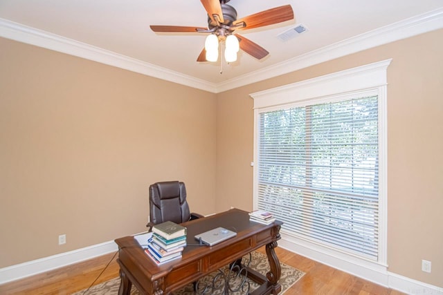 office area with light hardwood / wood-style floors, ornamental molding, and ceiling fan