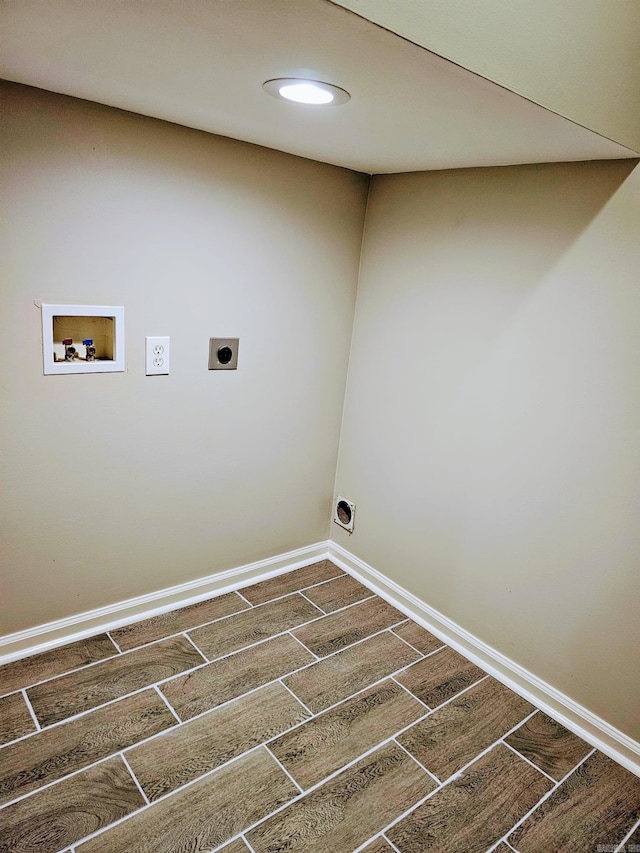 laundry room with washer hookup, wood tiled floor, electric dryer hookup, laundry area, and baseboards