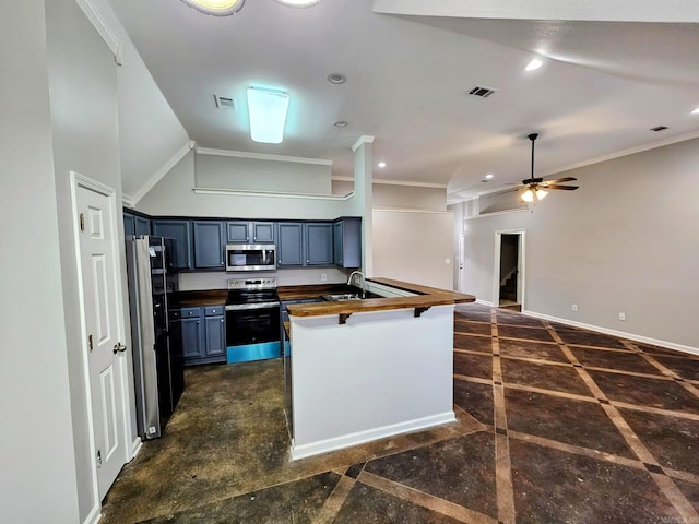 kitchen with stainless steel appliances, wooden counters, visible vents, and baseboards