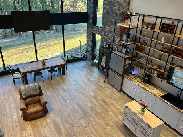 living room with washer / dryer and light wood-type flooring