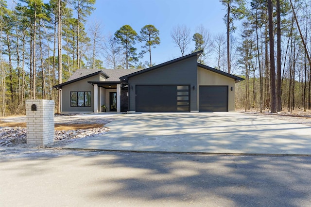 view of front of property featuring a garage and concrete driveway