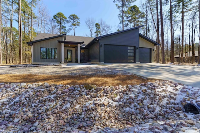 view of front of property with a garage and concrete driveway