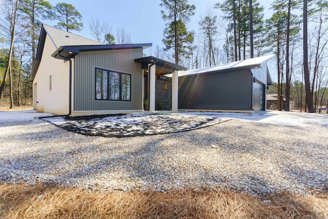 view of front of property featuring concrete driveway, brick siding, and an attached garage