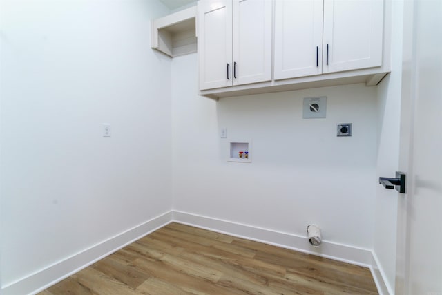 laundry room featuring cabinet space, light wood finished floors, baseboards, hookup for a washing machine, and hookup for an electric dryer