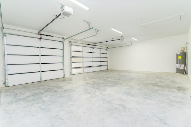 garage featuring water heater and a garage door opener